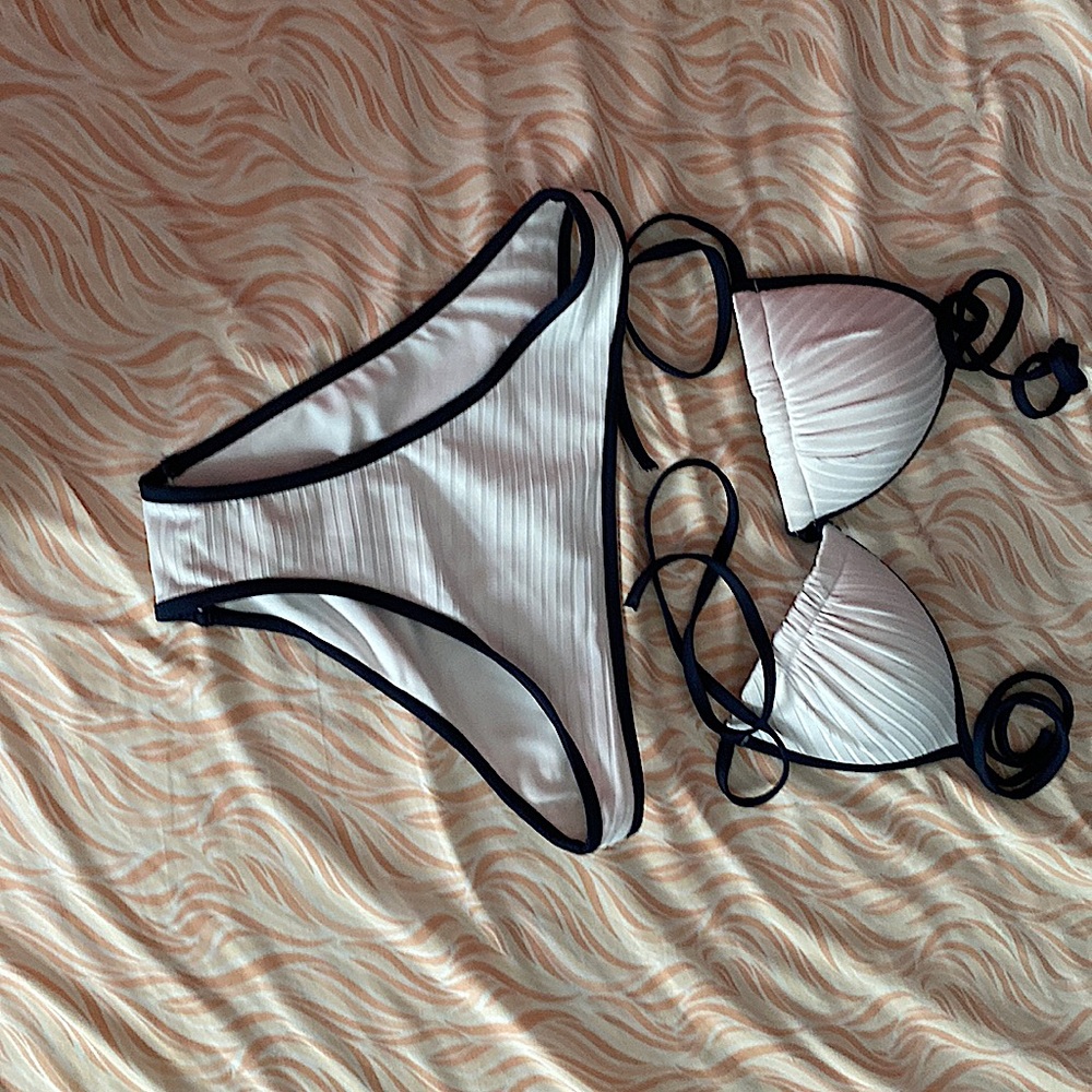 Bikini sold by H&M, top size 4, bottom size 2. white base, navy blue outline.